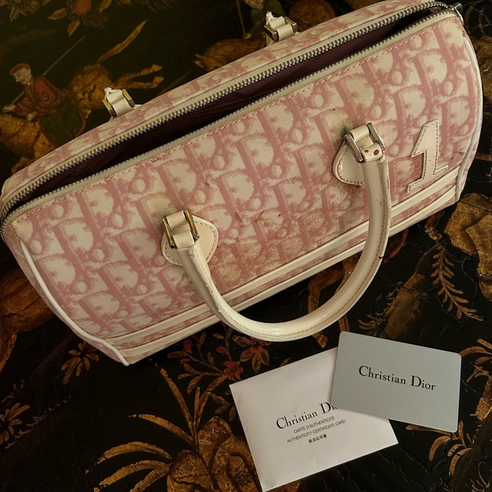 Dior pink bag, please be aware there are stains on the bag.